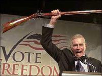 Charlton heston with gun